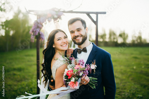 Fotografia, Obraz Happy bride and groom after wedding ceremony