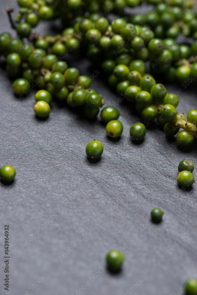 Fresh green pepper on dark background.