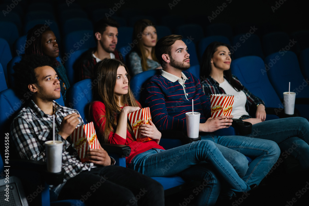 Obraz premium Watching a drama movie in the cinema