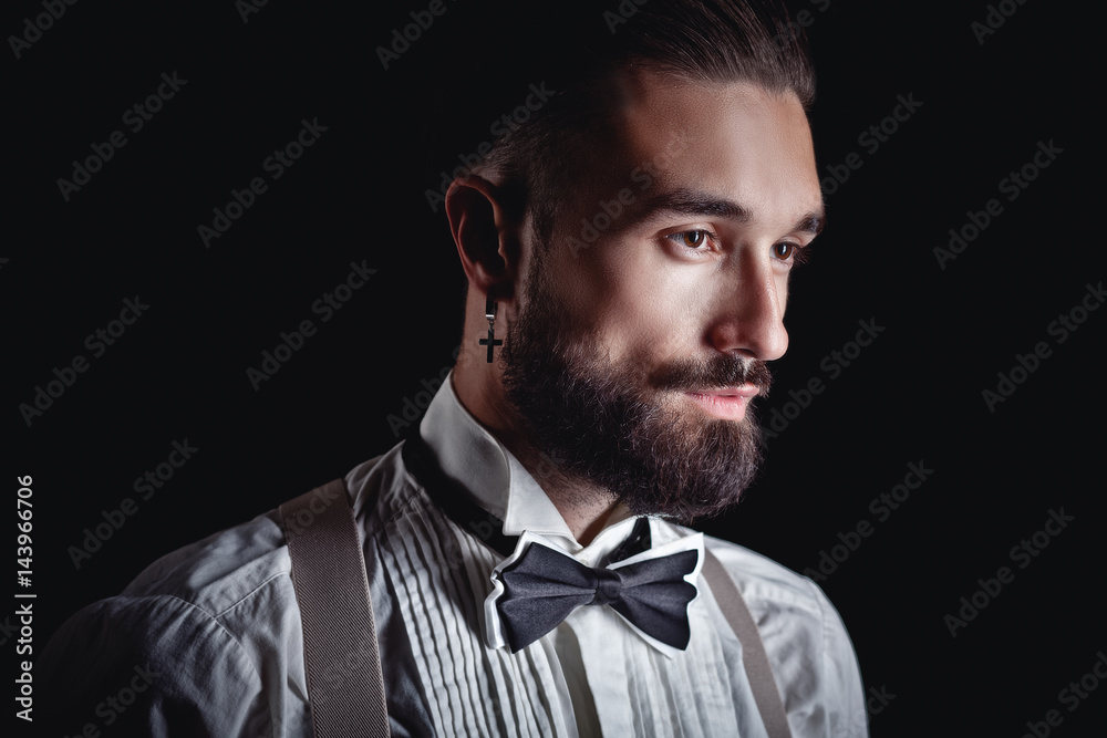 Portrait of handsome man posing for photographer in studio Portrait of handsome man posing for photographer in studio