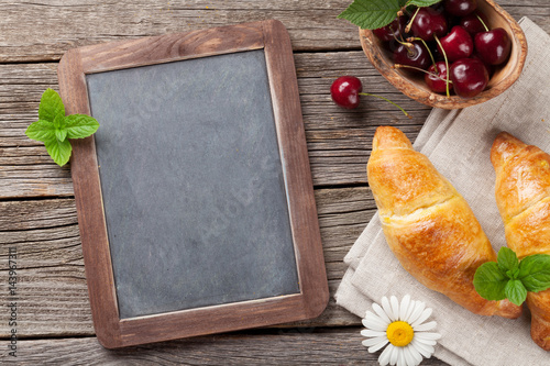 Blackboard for your text and croissants