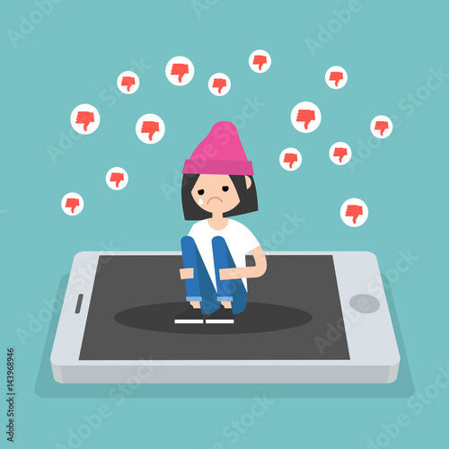 Upset crying girl sitting on the mobile's screen and hugging her knees surrounded by the dislike symbols / editable flat vector illustration, clip art