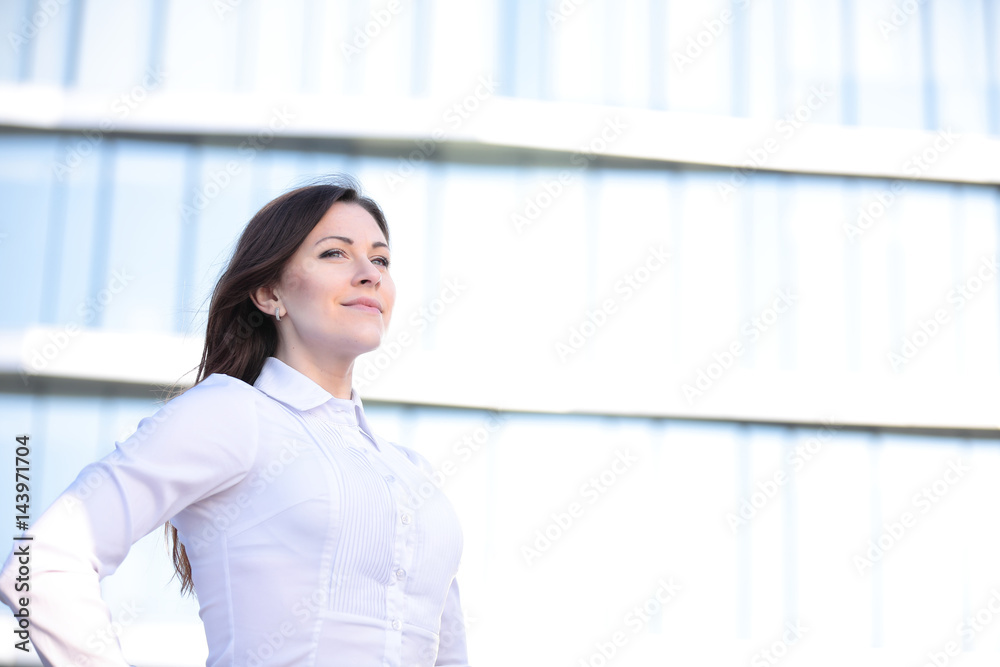 Portrait of a successful business woman smiling. Beautiful young female executive in an urban setting Portrait of a successful business woman smiling. Beautiful young female executive in an urban setting