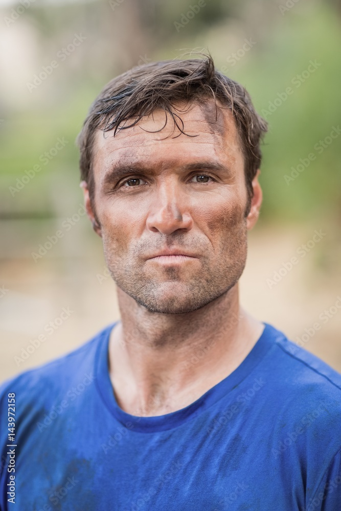Portrait of determined man standing during obstacle course Portrait of determined man standing during obstacle course