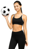 Beautiful smiling teenage girl with soccer ball