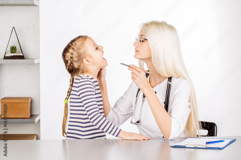 doctor examining a child girl in a hospital doctor examining a child girl in a hospital