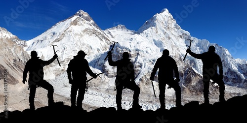 mount Everest and Lhotse and silhouette of climbers photo