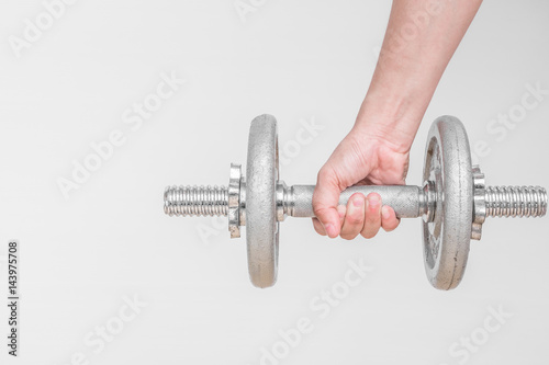 hand taking dumbbell for bodybuilder. Concept for sport player or workout. gym of accessories for fitness