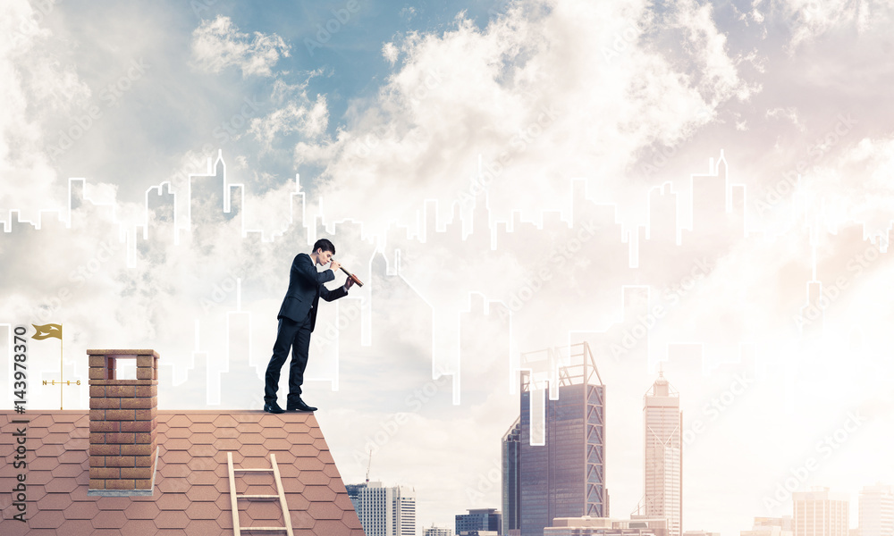 Engineer man standing on roof and looking in spyglass. Mixed med Engineer man standing on roof and looking in spyglass. Mixed med