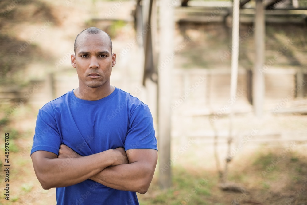 Portrait of fit man standing with arms crossed Portrait of fit man standing with arms crossed