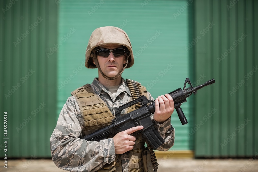 Military soldier standing with a rifle Military soldier standing with a rifle