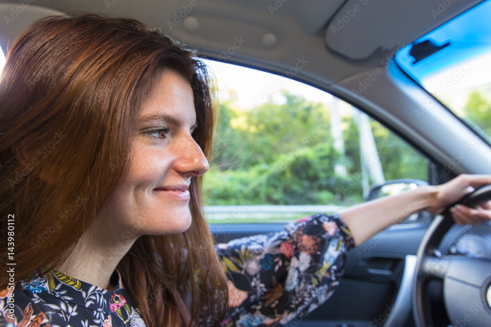 Attractive young woman driving car Attractive young woman driving car