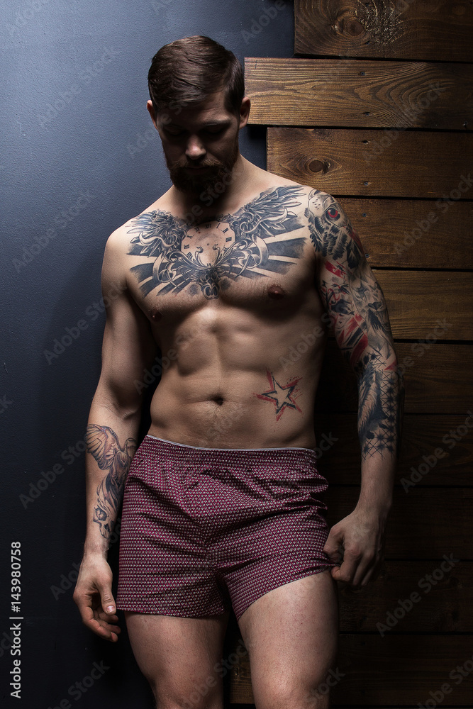 Inflated guy with tattoo in panties. Stock Photo | Adobe Stock