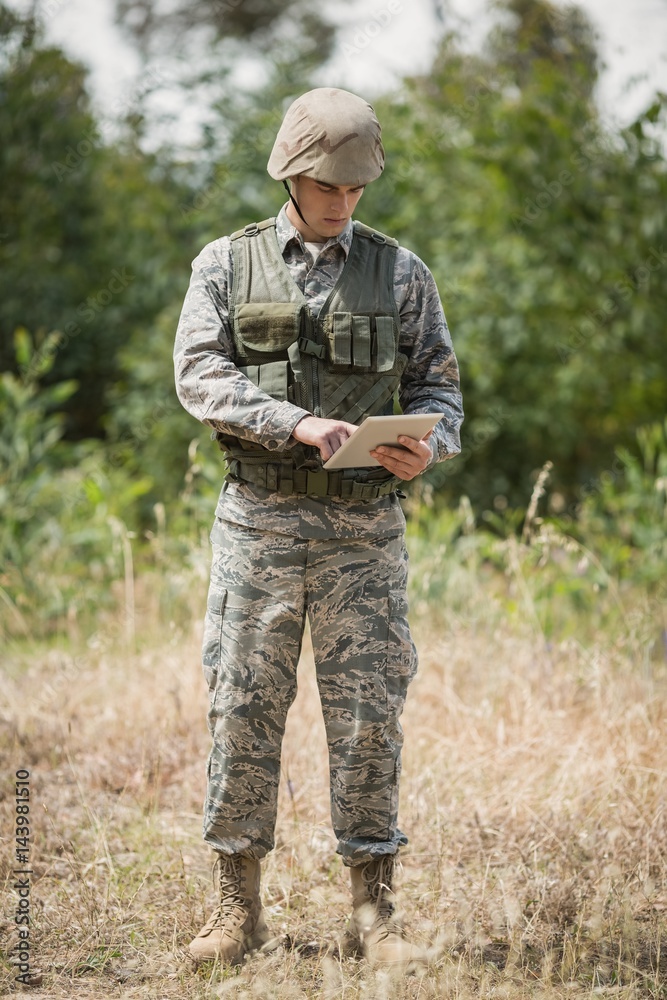 Military soldier using digital tablet Military soldier using digital tablet