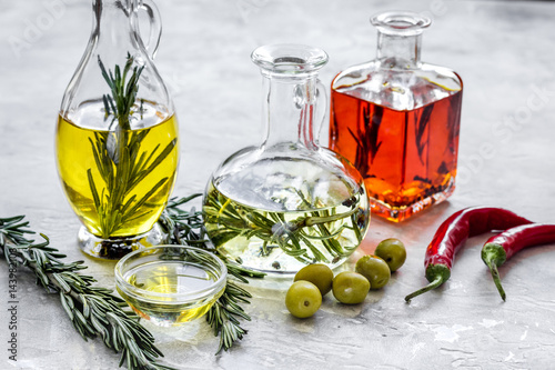 Fototapeta Naklejka Na Ścianę i Meble -  natural oils concept with fresh olives and chili paper on table background