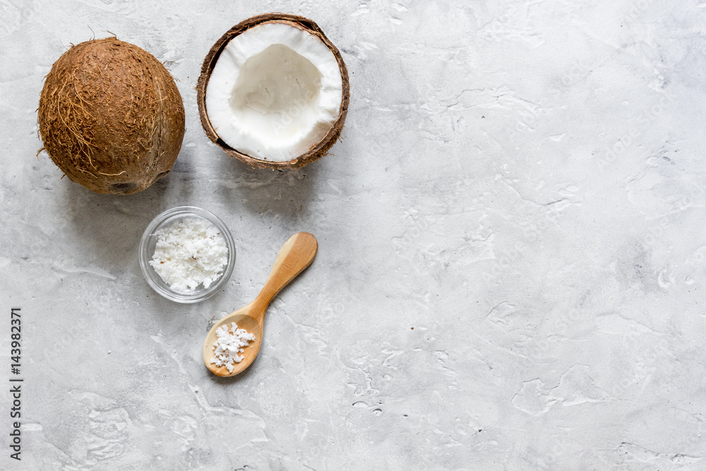 fresh coconut with cosmetic oil in jar on gray background top view fresh coconut with cosmetic oil in jar on gray background top view