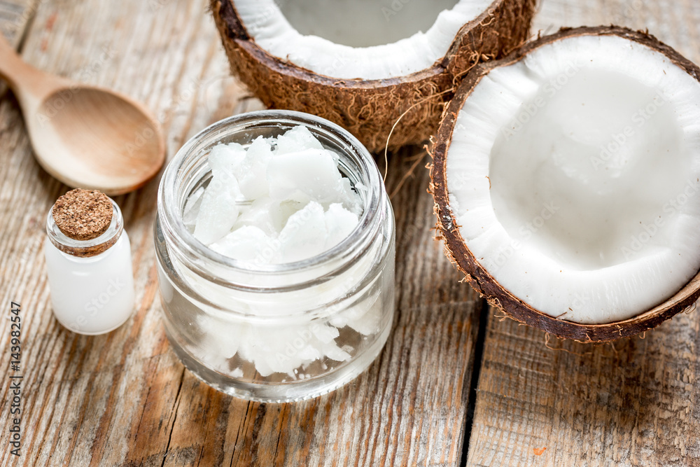 organic cosmetics concept with coconut on table background