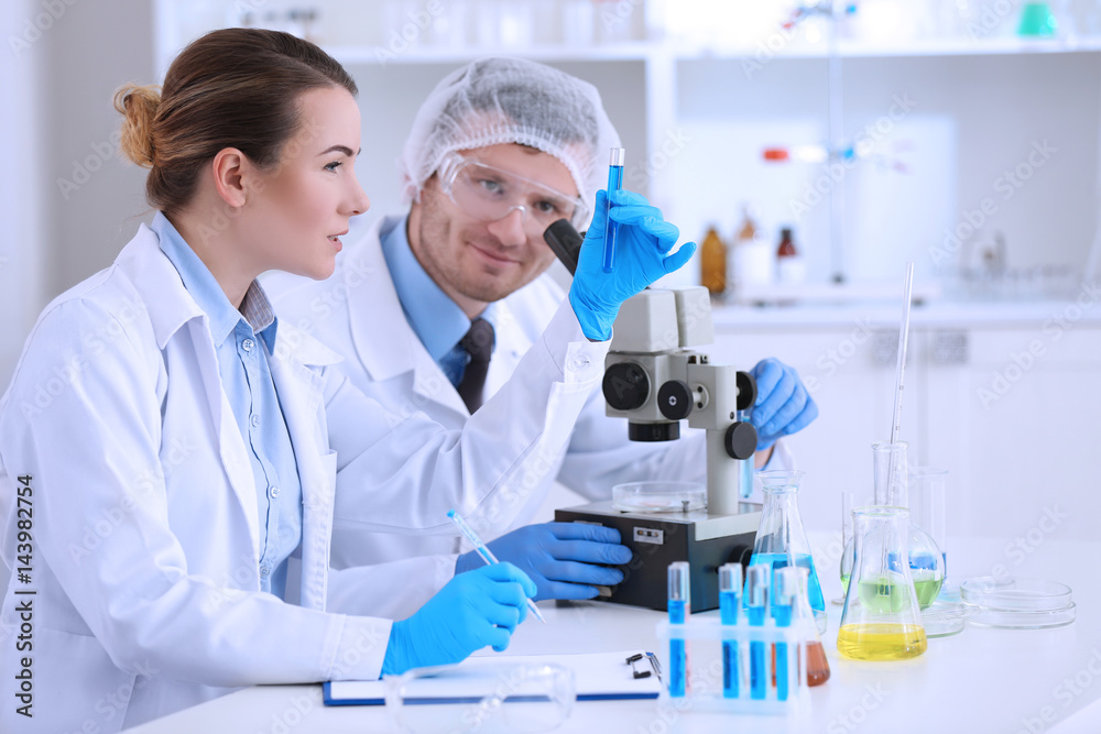 Scientists working in a laboratory Scientists working in a laboratory