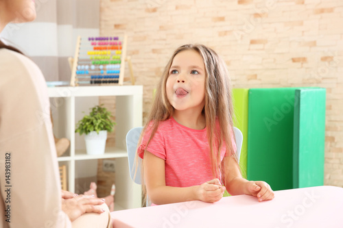 Little girl with teacher on...