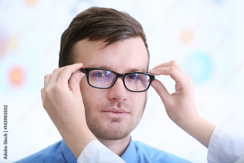Young patient visiting ophthalmologist in cabinet Young patient visiting ophthalmologist in cabinet
