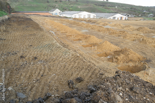 the quarry of clay, prepared to build, texture of clay with  traces of the tractor