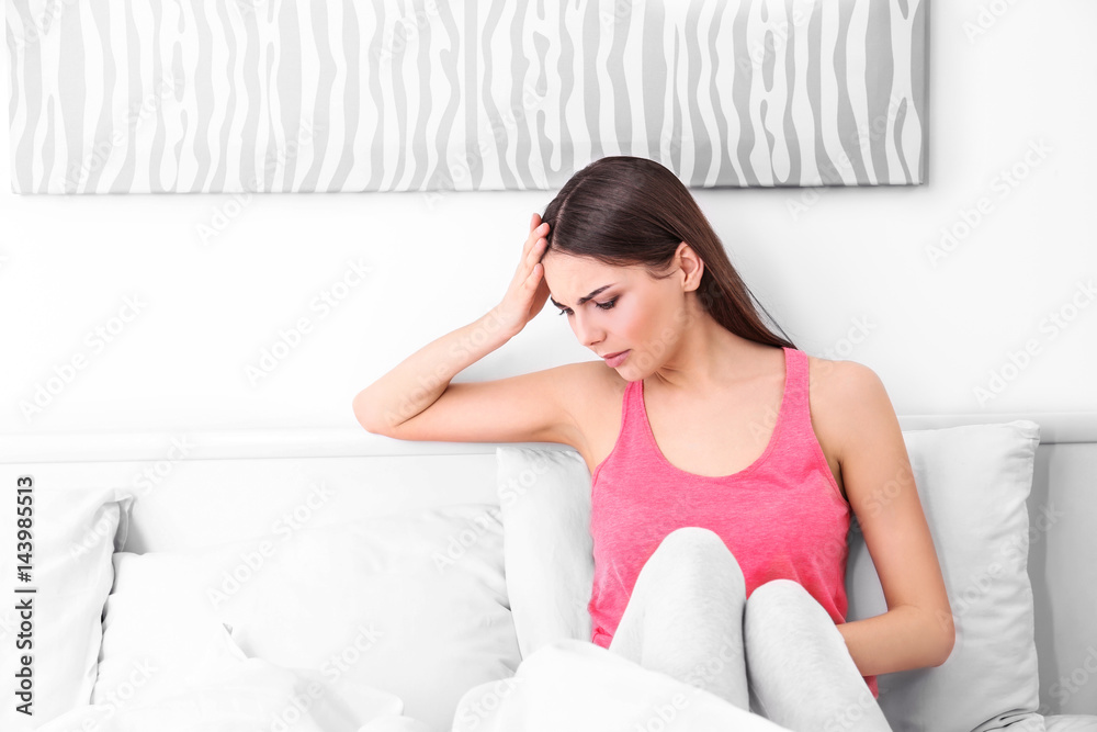 Young sick woman in bed at home Young sick woman in bed at home