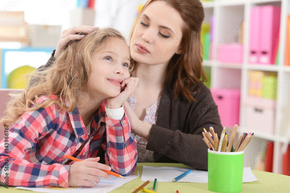 Mom and daughter doing lessons Mom and daughter doing lessons