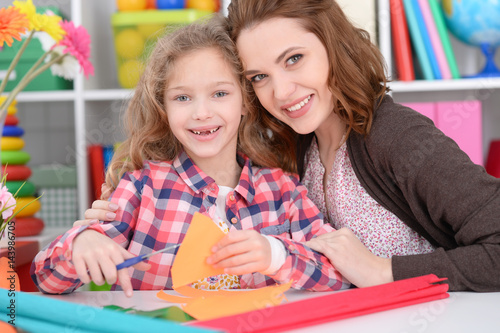 Mom and daughter are playing 