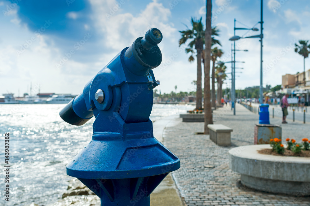 Binoculars for tourists on the waterfront, horizontal frame