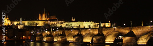 Lights of Prague castle and Charls bridge at night photo