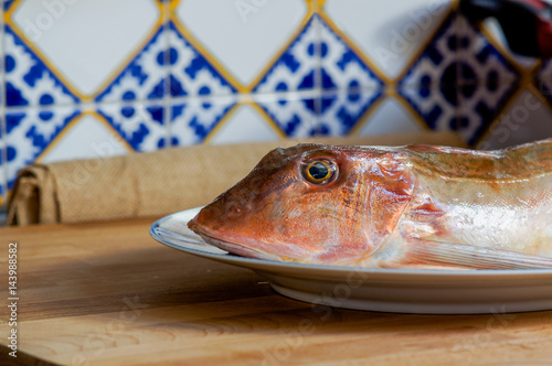 Foto Fresh fish with red scales