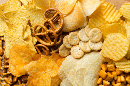 Salty snacks. Pretzels, chips, crackers photo