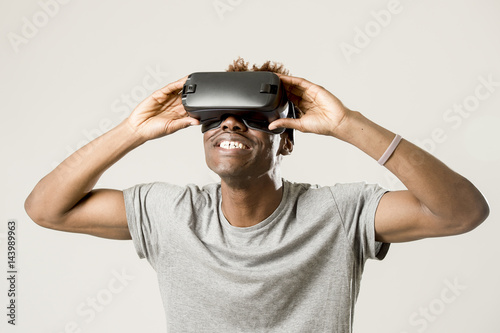 afro american man wearing virtual reality vr 360 vision goggles enjoying video game
