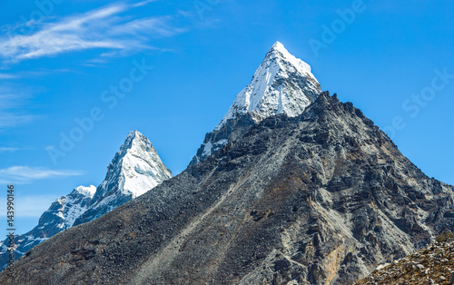 Nirekha (6169 m), Kangchung (6063 m), and Cholo (6089 m) in the area of Cho Oyu. View Ngozumba glacier near Thopak Tsho (4990 m) - Gokyo region, Nepal, Himalayas photo