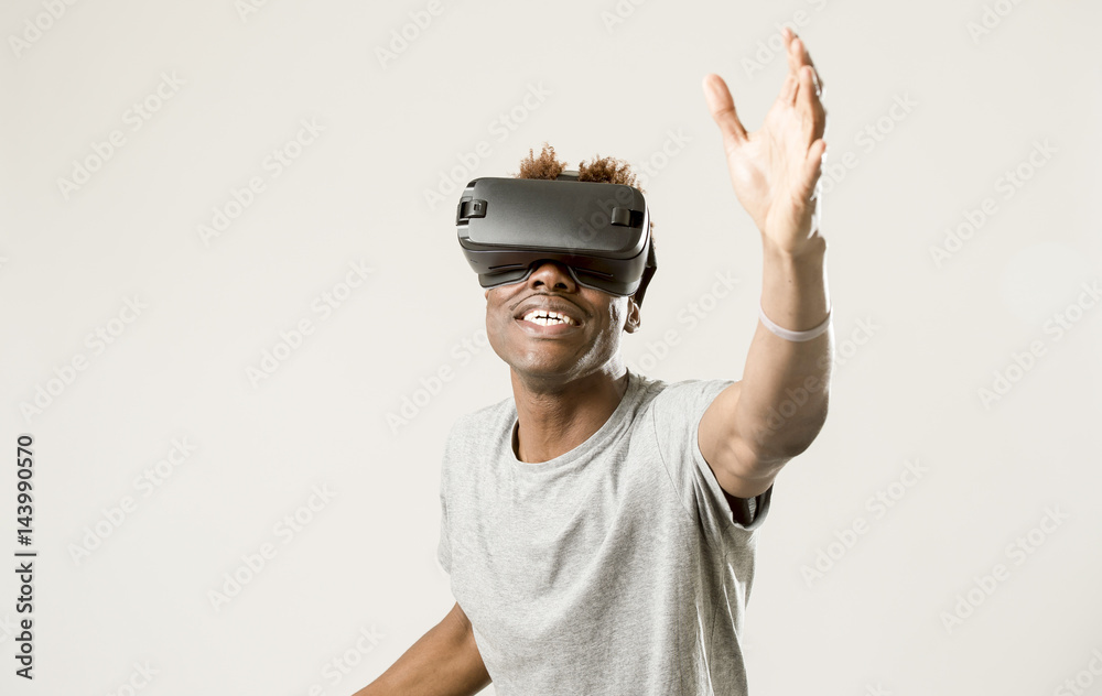 afro american man wearing virtual reality vr 360 vision goggles enjoying video game