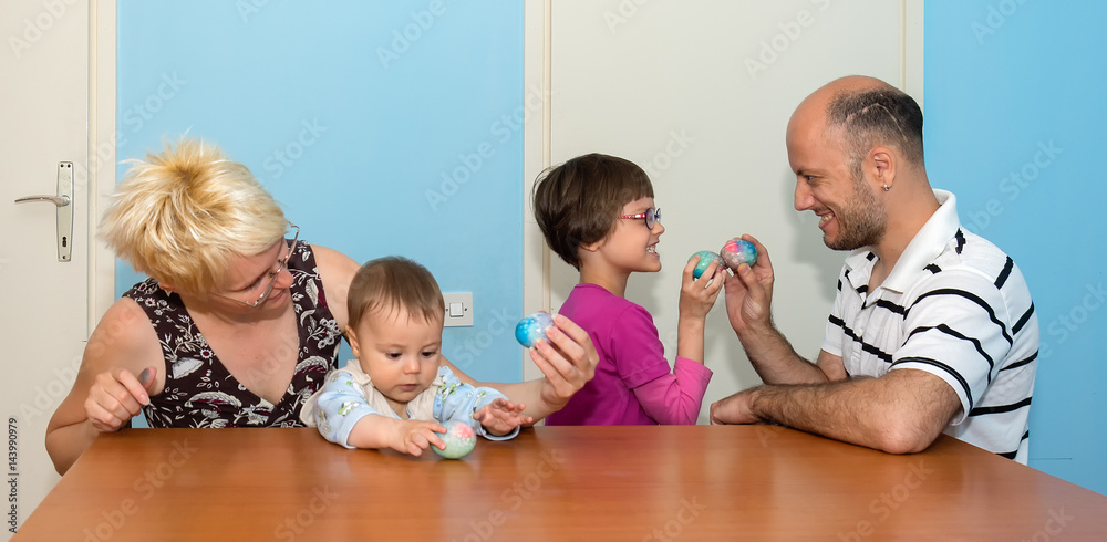Naklejka premium Family having breakfast on Easter day