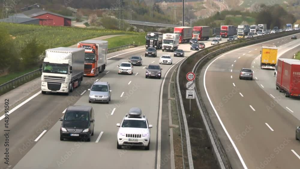 Dense traffic on German highway A3 between Idstein and Bad Camberg. A3 is a heavily frequented highway that connects Frankfurt with Cologne Dense traffic on German highway A3 between Idstein and Bad Camberg. A3 is a heavily frequented highway that connects Frankfurt with Cologne