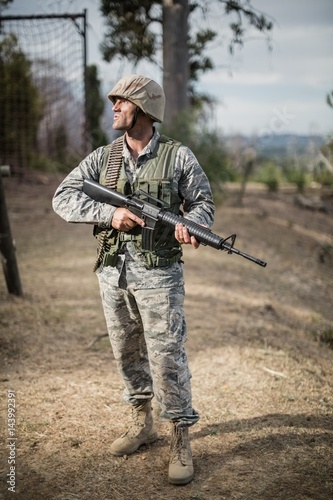 Military soldier during training exercise with weapon