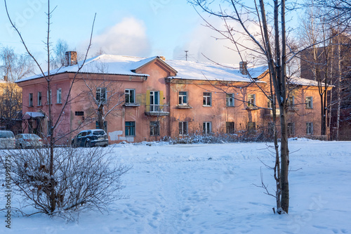 Old two-storey house in winter © Sergei Gorin