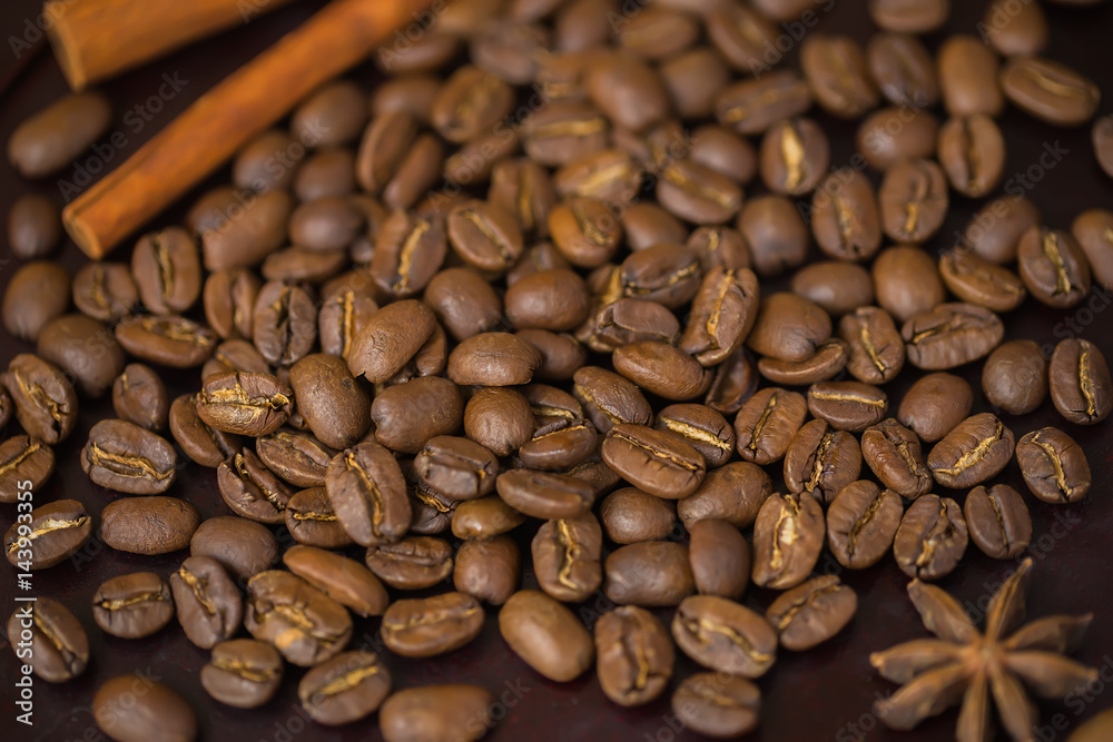 Fototapeta premium Grains of coffee close-up. Texture of extra large arabica Maragogype bean of very high quality, considered one of the best beans in the world. Coffee break concept.