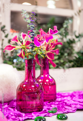 Bouquet flowers in glass vase.