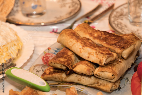 pancakes with meat on a beautiful plate on table