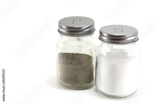 Pepper and salt shakers on a white isolated background