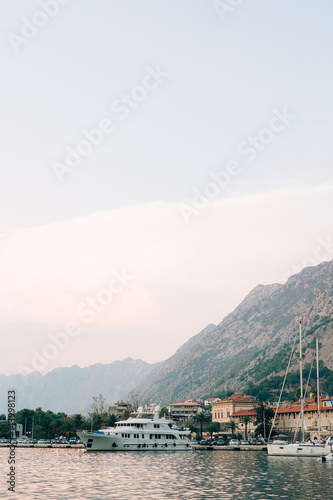 Sailboat near the old town of Kotor, Bay of Kotor, Montenegro © Nadtochiy