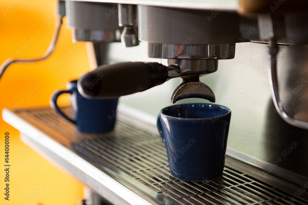 Machine making cup of coffee in cafe Machine making cup of coffee in cafe