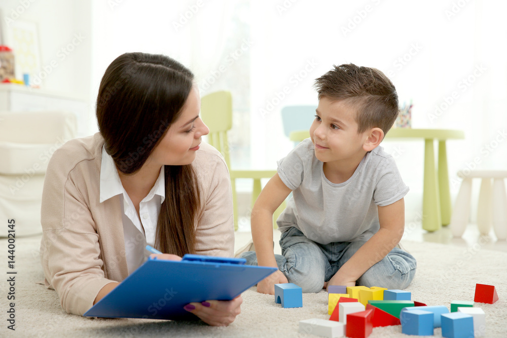 Young child psychologist working with little boy Young child psychologist working with little boy
