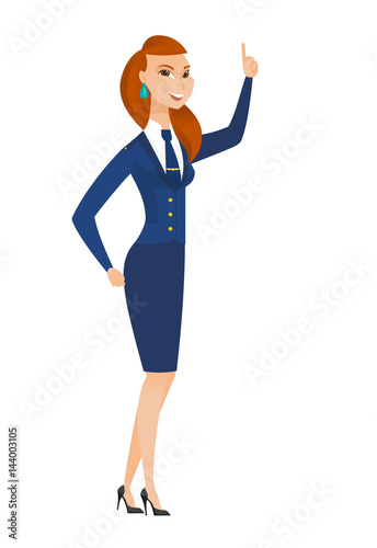 Caucasian stewardess pointing with her forefinger