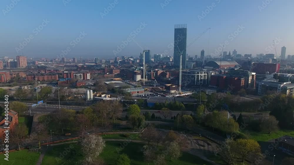 Slow drifting aerial view of Manchester city centre, UK.