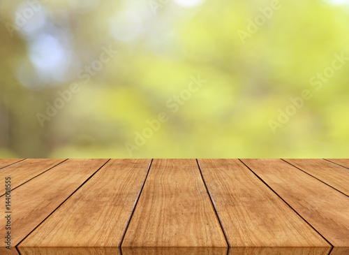 Nature spring or summer with sunlight background and wood table