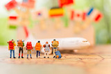 miniature people, travel by plane for travel. using as business background concept.